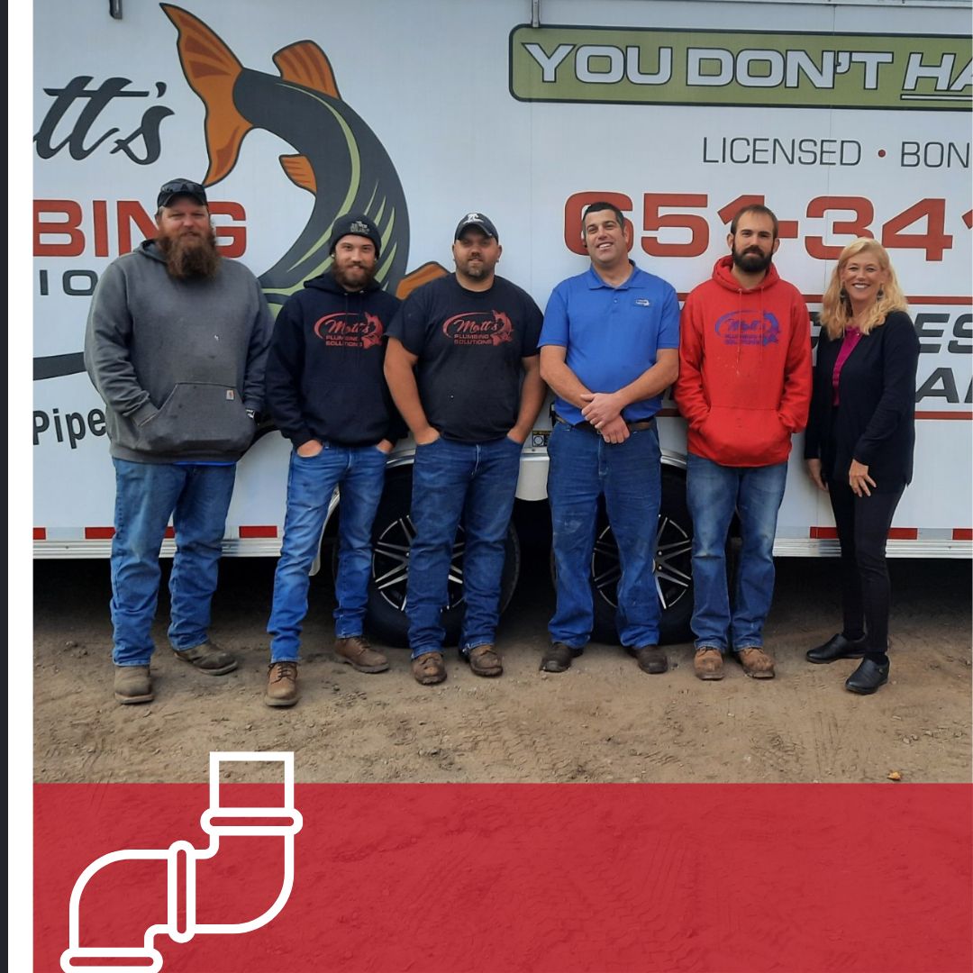 Fish Plumbing & Utilities team in front of truck
