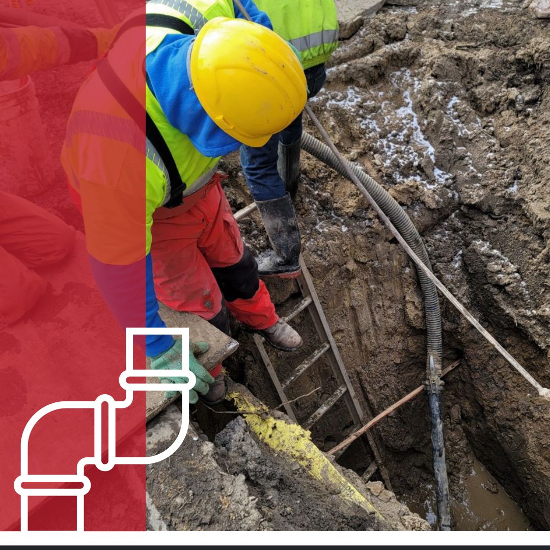 plumber descending ladder to work on inground pipe