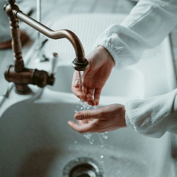 hands in sink