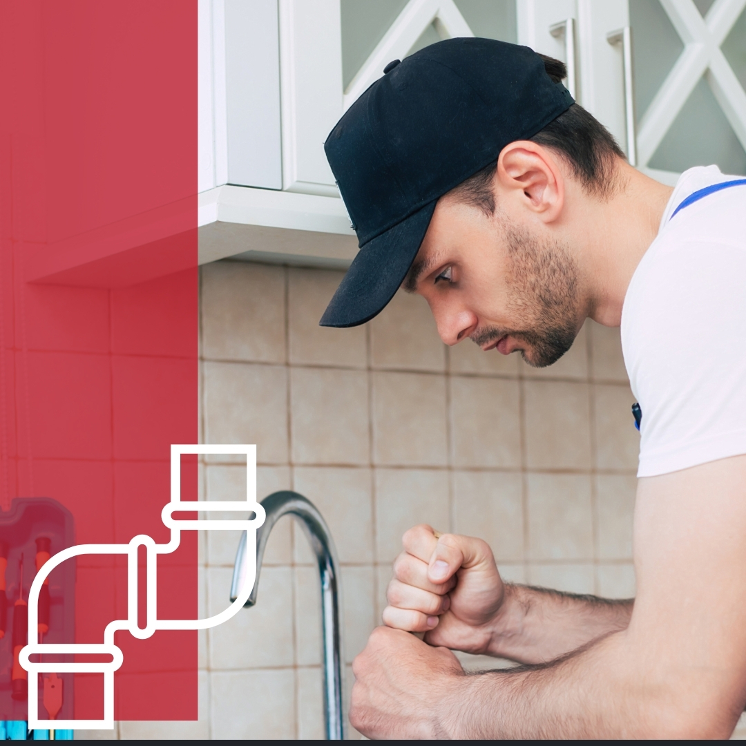 Plumber working on sink