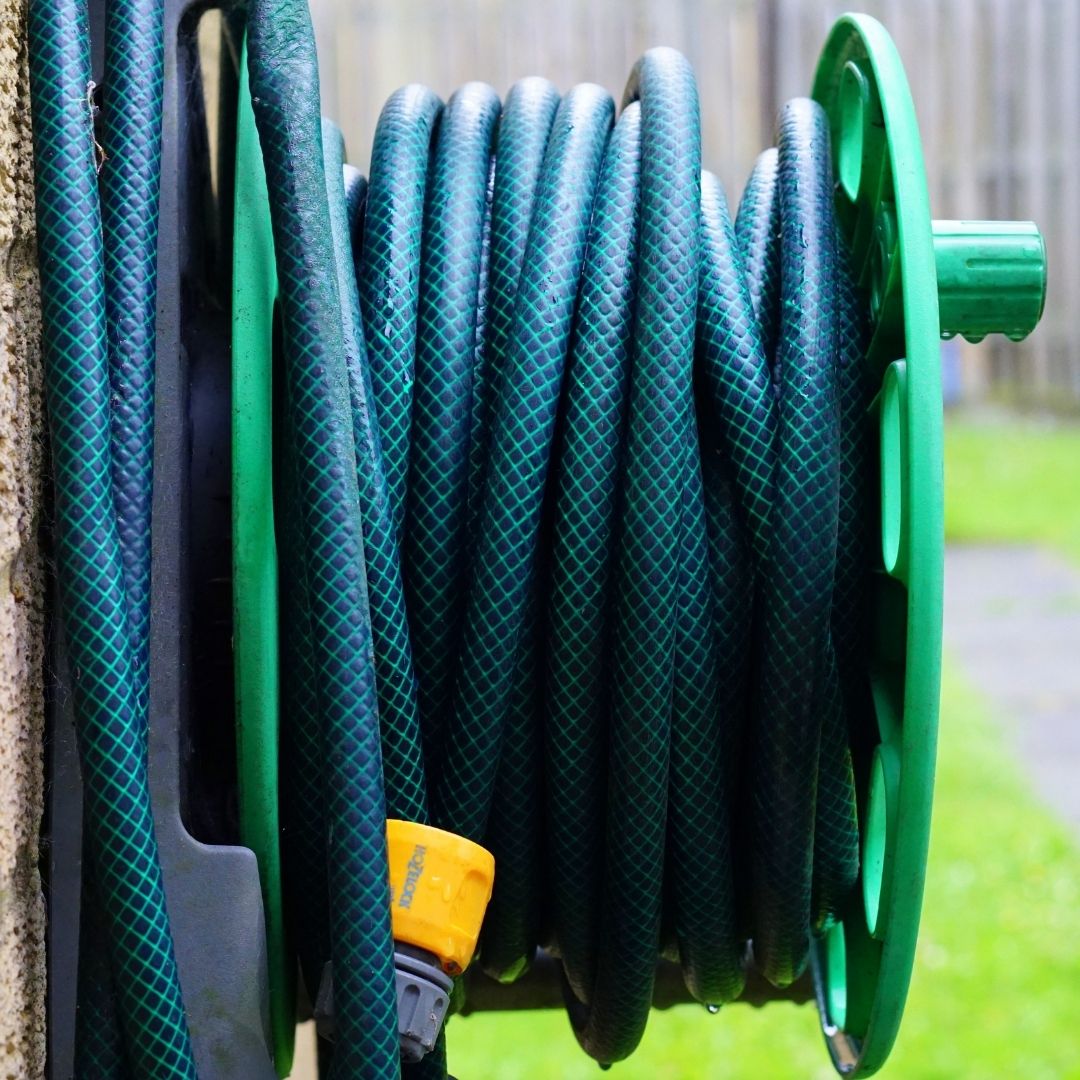 pipe hanging on outside of house