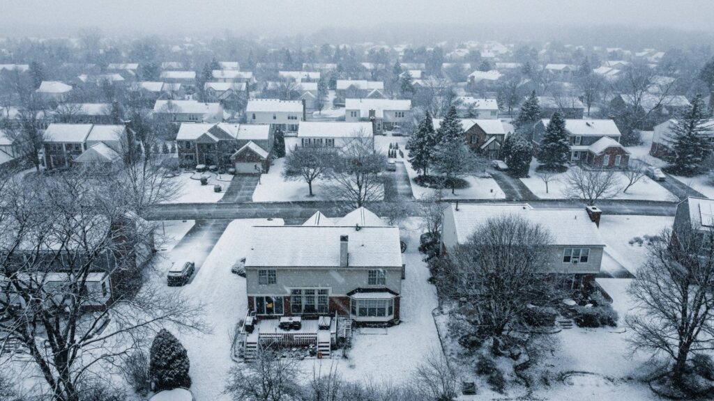 a community of houses with snow