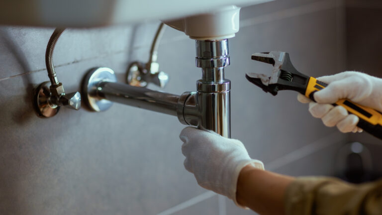 plumber fixing sink
